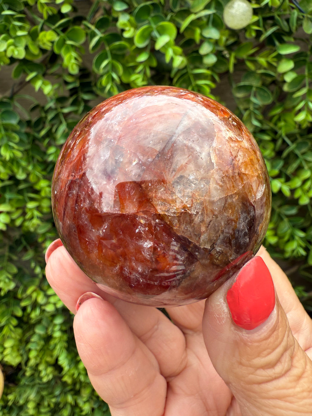 Fire Quartz Sphere from Madagascar with stand. Approx 5.5cm