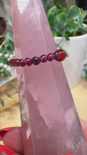 Load and play video in Gallery viewer, Garnet Stretch Ring with Carnelian Single Bead
