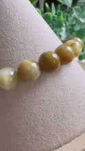 Load and play video in Gallery viewer, Yellow Tigers Eye 7/8mm Beaded Stretch Bracelet
