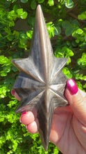 Load and play video in Gallery viewer, Silver Sheen Obsidian Star on Black Stand
