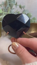 Load and play video in Gallery viewer, Black Obsidian Heart on Stand |Consciously Sourced|Brazil|Crystal Carving
